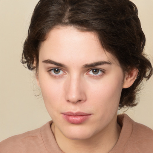 Neutral white young-adult female with medium  brown hair and brown eyes