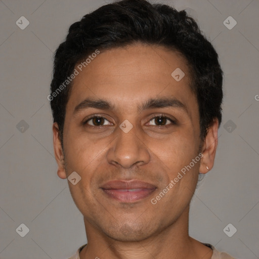 Joyful latino young-adult male with short  black hair and brown eyes