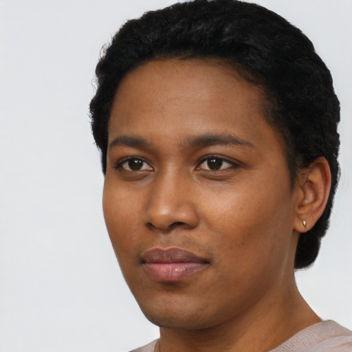 Neutral black young-adult female with short  black hair and brown eyes