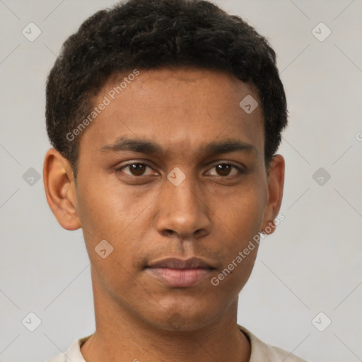 Neutral latino young-adult male with short  brown hair and brown eyes