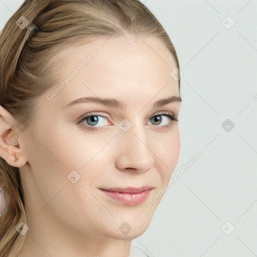 Joyful white young-adult female with long  brown hair and blue eyes