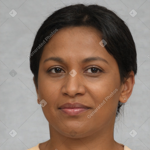 Joyful latino young-adult female with short  brown hair and brown eyes