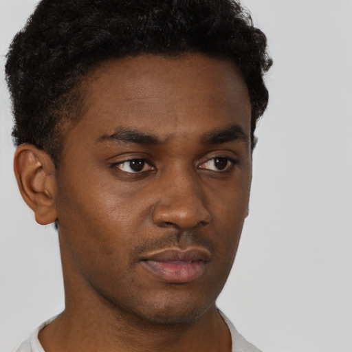 Neutral black young-adult male with short  brown hair and brown eyes
