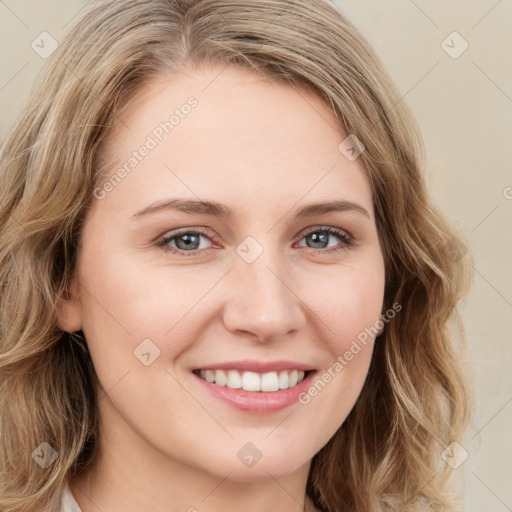 Joyful white young-adult female with long  brown hair and green eyes