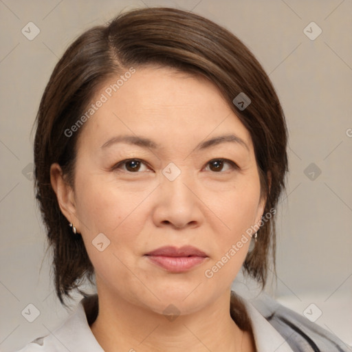 Joyful white adult female with medium  brown hair and brown eyes