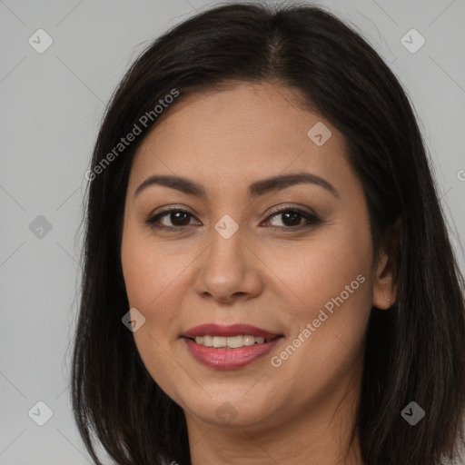 Joyful latino young-adult female with long  brown hair and brown eyes