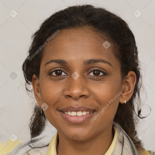 Joyful black young-adult female with medium  brown hair and brown eyes