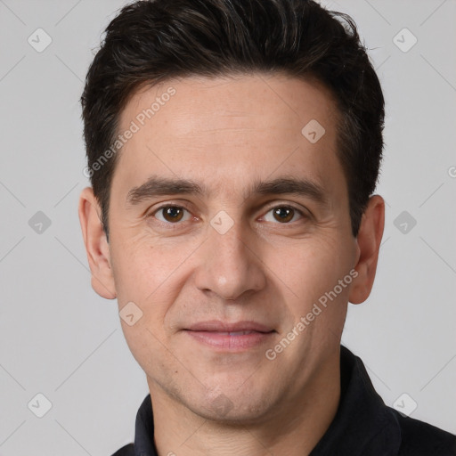 Joyful white adult male with short  brown hair and brown eyes