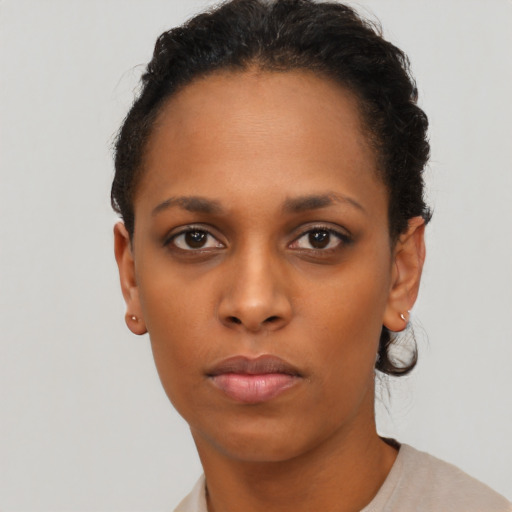 Neutral black young-adult female with short  black hair and brown eyes
