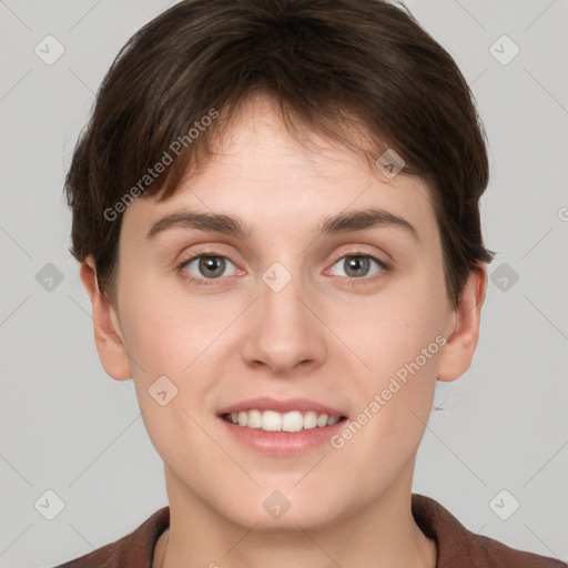 Joyful white young-adult female with short  brown hair and grey eyes