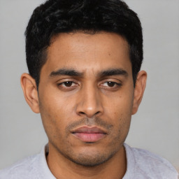 Neutral latino young-adult male with short  black hair and brown eyes