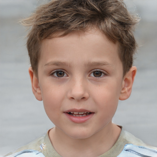 Joyful white child male with short  brown hair and brown eyes