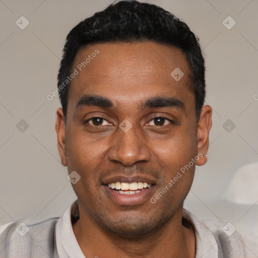 Joyful black young-adult male with short  black hair and brown eyes