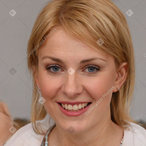 Joyful white young-adult female with medium  brown hair and blue eyes