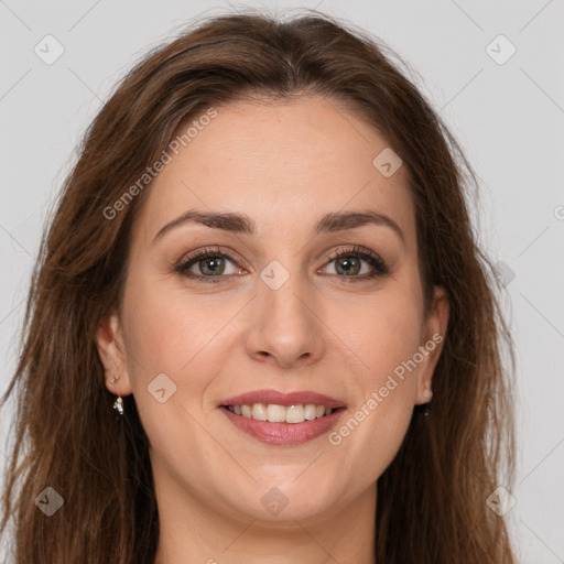 Joyful white young-adult female with long  brown hair and green eyes