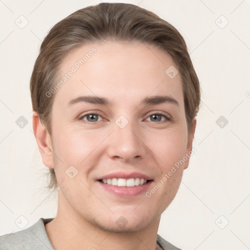 Joyful white young-adult female with short  brown hair and grey eyes