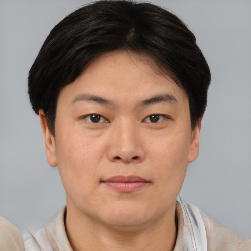 Neutral asian young-adult male with short  brown hair and brown eyes