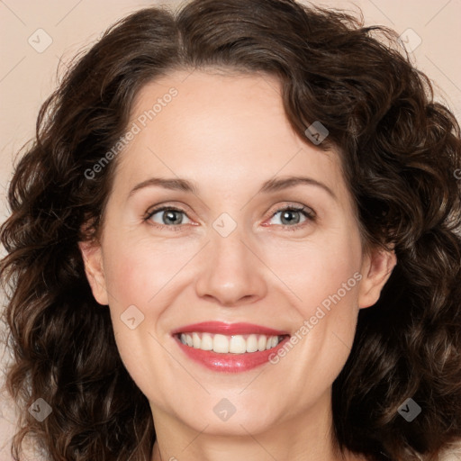 Joyful white adult female with medium  brown hair and green eyes