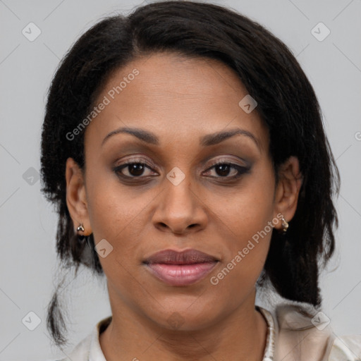 Joyful latino adult female with medium  brown hair and brown eyes