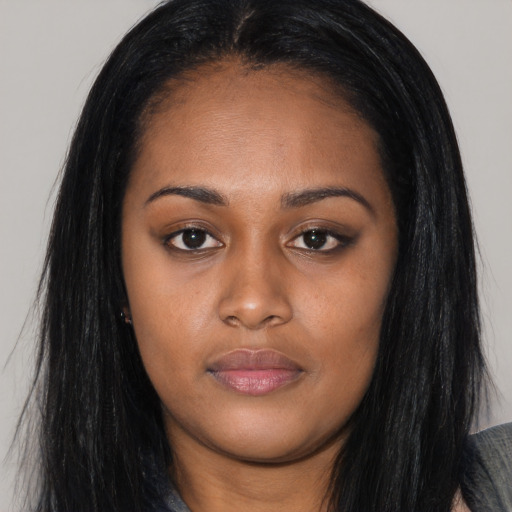 Joyful asian young-adult female with long  black hair and brown eyes
