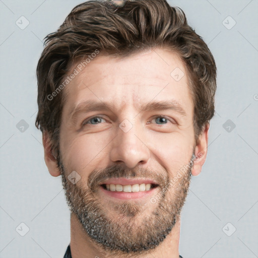 Joyful white adult male with short  brown hair and grey eyes