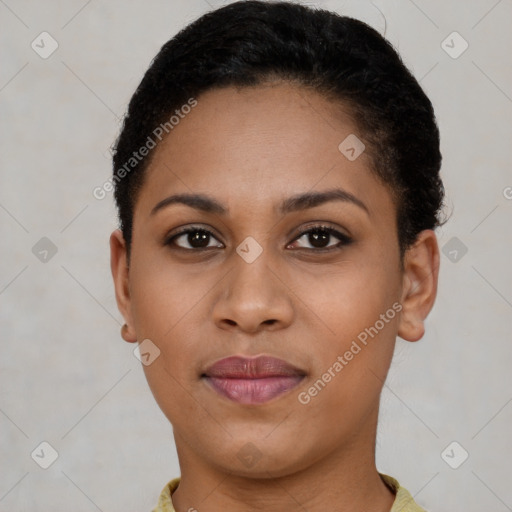 Joyful black young-adult female with short  black hair and brown eyes