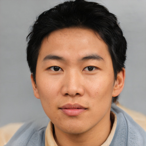 Neutral asian young-adult male with short  black hair and brown eyes