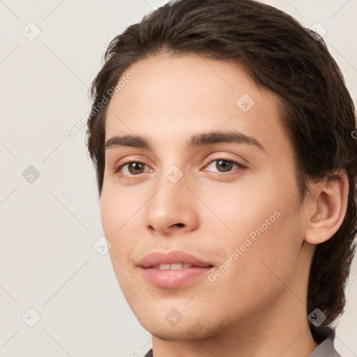 Joyful white young-adult male with medium  brown hair and brown eyes