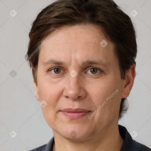 Joyful white adult female with short  brown hair and grey eyes