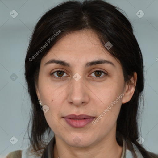 Joyful white adult female with medium  brown hair and brown eyes