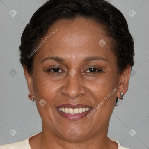 Joyful latino adult female with short  brown hair and brown eyes