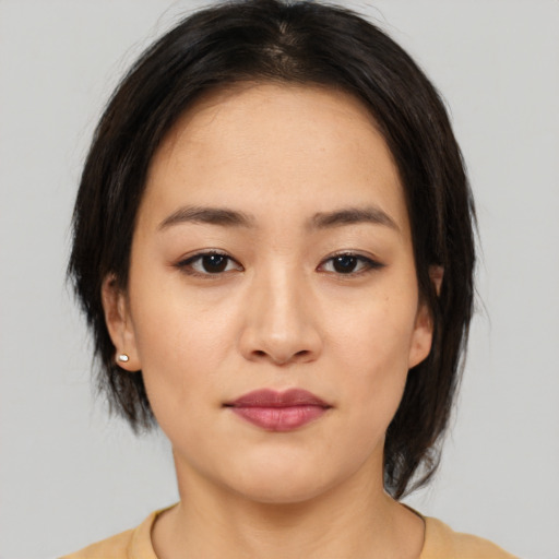 Neutral asian young-adult female with medium  brown hair and brown eyes