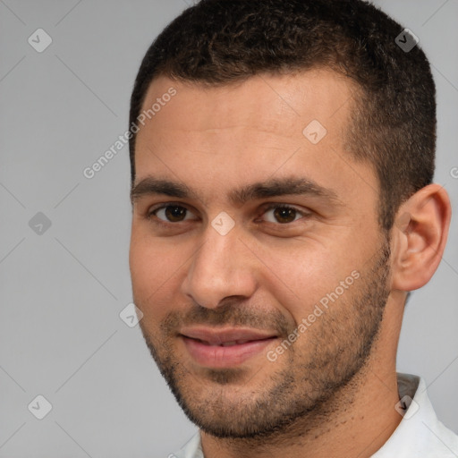 Joyful white young-adult male with short  brown hair and brown eyes