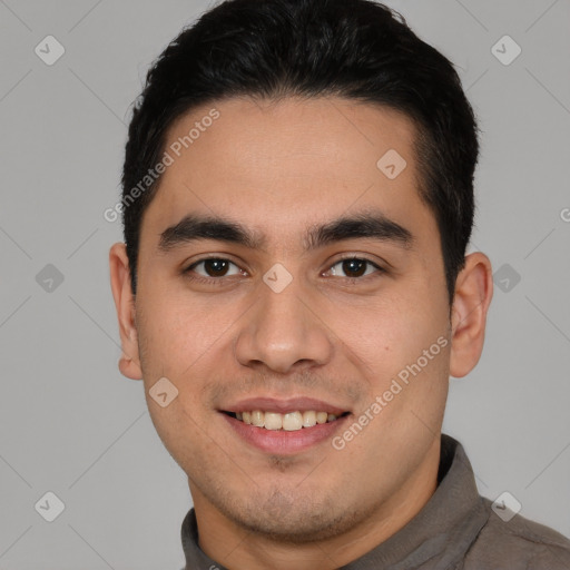 Joyful latino young-adult male with short  brown hair and brown eyes