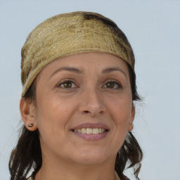 Joyful white adult female with long  brown hair and brown eyes