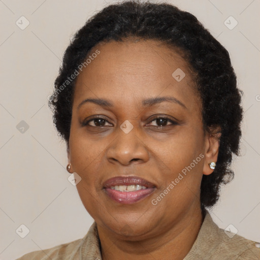 Joyful black adult female with short  brown hair and brown eyes