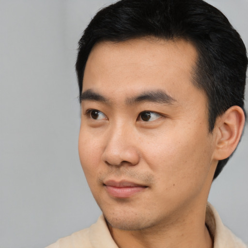 Neutral asian young-adult male with short  black hair and brown eyes