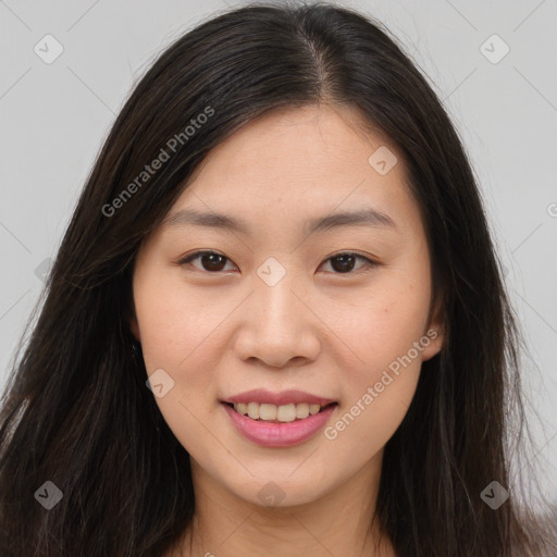 Joyful asian young-adult female with long  brown hair and brown eyes