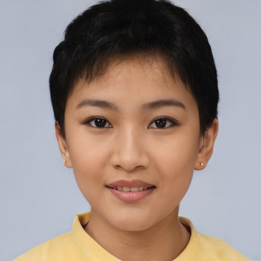 Joyful asian young-adult female with short  brown hair and brown eyes