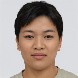 Joyful asian young-adult female with short  black hair and brown eyes