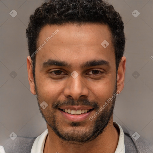 Joyful white young-adult male with short  black hair and brown eyes