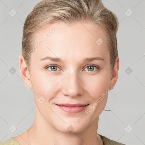 Joyful white young-adult female with short  brown hair and blue eyes