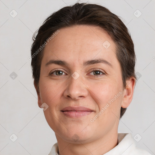 Joyful white adult female with short  brown hair and brown eyes