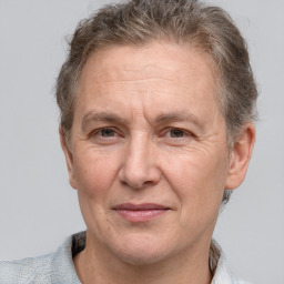 Joyful white middle-aged male with short  brown hair and brown eyes