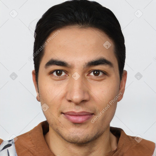 Joyful latino young-adult male with short  black hair and brown eyes