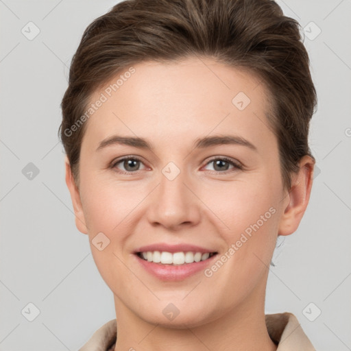 Joyful white young-adult female with short  brown hair and grey eyes