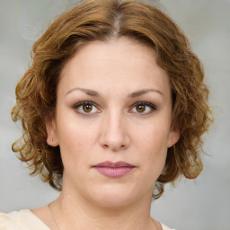 Joyful white young-adult female with medium  brown hair and green eyes