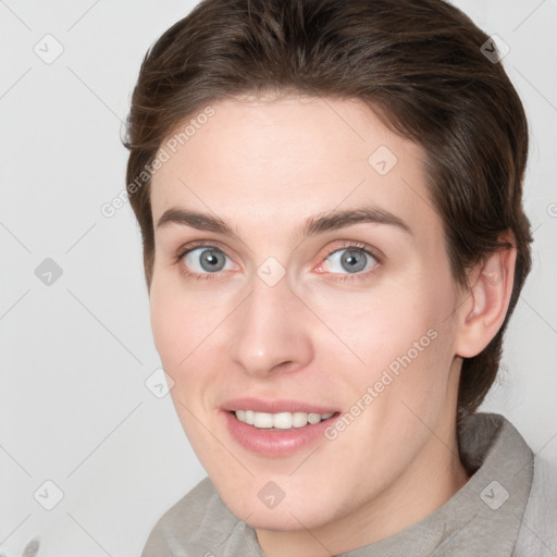 Joyful white young-adult female with short  brown hair and grey eyes