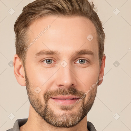 Joyful white young-adult male with short  brown hair and grey eyes