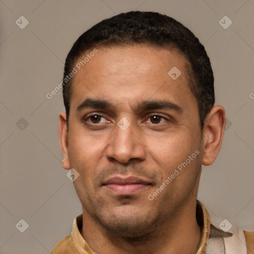 Joyful latino young-adult male with short  black hair and brown eyes